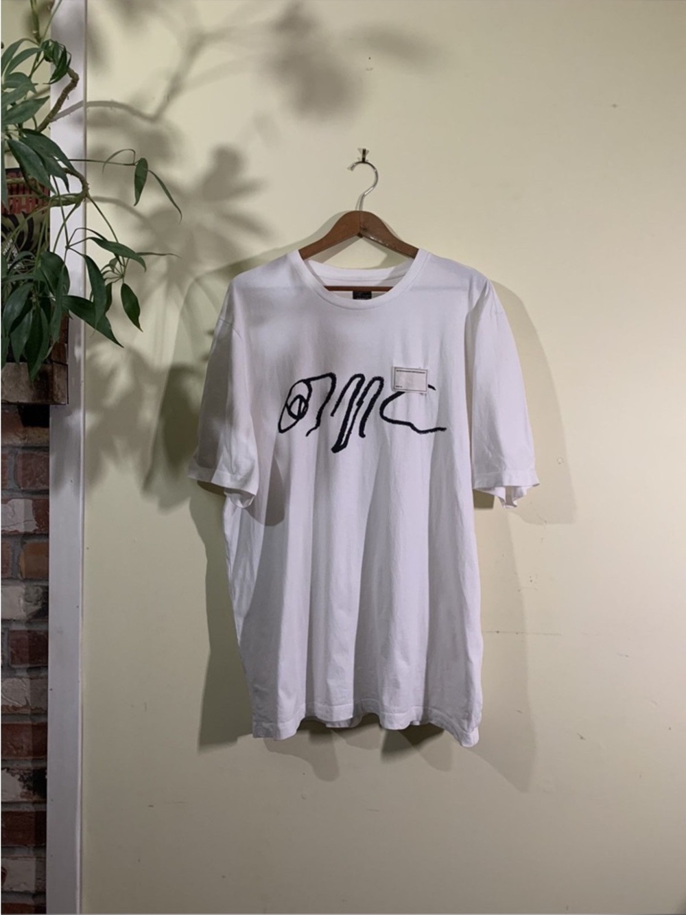 White OAMC Spray tee “Do you know where your children are”